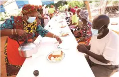  ??  ?? First Lady Auxillia Mnangagwa serves tea to senior citizens at Dete Old Age Home yesterday.