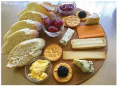  ??  ?? BREAD Platter - cheese and bread produced by the bistro