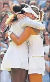  ??  ?? Angelique Kerber celebrates with the Venus Rosewater Dish yesterday after embracing opponent Serena Williams (above)