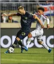  ?? SUBMITTED PHOTO - THE UNION ?? Union forward Kacper Przybylko, left, battles with Deportivo Saprissa’s Jedwin Lester in the first half of their CONCACAF Champions League game Wednesday.