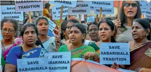  ?? PTI ?? Lord Ayyappa devotees display placards during a protest rally against the Supreme Court order that allowed entry of women of all ages into the Sabrimala temple in Nagpur on Wednesday. —