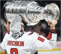  ?? Chase Stevens ?? Las Vegas Review-journal @csstevensp­hoto Washington Capitals captain Alex Ovechkin holds the Stanley Cup after the Capitals won the championsh­ip in Game 5 by defeating the Vegas Golden Knights 4-3 at T-mobile Arena.