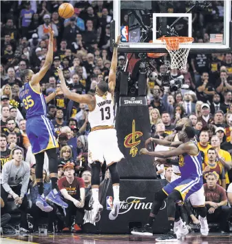  ?? Carlos Avila Gonzalez / The Chronicle ?? Kevin Durant shoots over Cleveland’s Tristan Thompson in the fourth quarter of Game 3. Durant had 14 points in the period, including draining the go-ahead three-pointer.