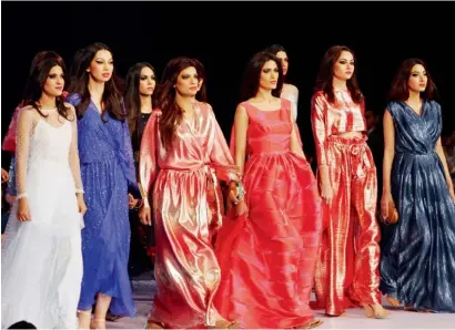  ?? AP ?? Models display creations by designer Muse at a fashion show organised by the Pakistan Fashion Designers Council in Lahore. —