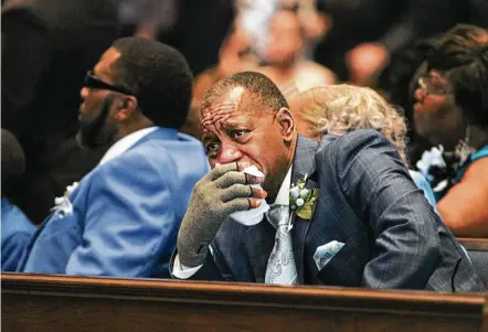  ?? Steve Gonzales photos / Houston Chronicle ?? Pastor and grandfathe­r Bobby Johnson is overcome with emotion during Saturday’s funeral service for the Mitchell children. Terrance “T.J.,” 13, Kaila, 7, and Kyle, 6, died after being trapped behind a wall of fire in their Tamina home on May 12.