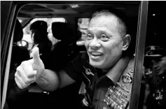  ??  ?? Nurmantyo gestures as he sits at his car after talking to reporters in Jakarta. — Reuters photo