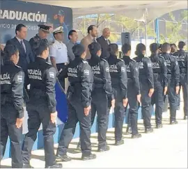  ?? Robin Abcarian Los Angeles Times ?? IN TECATE, Mexico, graduates of the police academy receive their diplomas. Most of them will be deployed to Tijuana, where the homicide rate has surged.