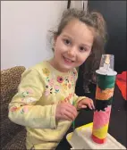  ??  ?? Abigail Konopka, aged four, with her working model of a lighthouse created during The Rockfield Centre’s online workshop.