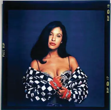  ?? Tom Reel / Staff photograph­er ?? Images from two photo shoots John Dyer had with Tejano icon Selena — one in 1992 and one in 1995 — are displayed in “Selena Forever/siempre Selena.”