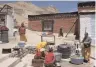 ?? AFP ?? Buddhist monks carry out daily chores at Gompa monastry in Spiti Valley.—