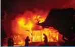  ??  ?? HEALDSBURG: The Soda Rock Winery burns during the Kincade fire as flames race through Healdsburg, California yesterday. —AFP