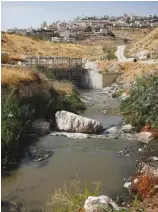  ??  ?? SEWAGE FLOWS through Kidron Valley on the outskirts of Jerusalem on July 6.