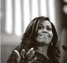  ?? Jessica Kourkounis / TNS ?? Former first lady Michelle Obama will host a podcast for Spotify, aiming to address topics of national interest.