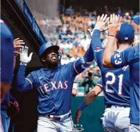  ?? Paul Sancya/associated Press ?? Rangers outfielder Adolis García hammered a solo home run to left-center field as part of a two-run third inning in the win over the Tigers on Thursday.