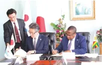  ?? ?? Finance, Economic Developmen­t and Investment Promotion Minister Professor Mthuli Ncube (right) and Japanese Ambassador to Zimbabwe Shinichi Yamanaka sign grant agreement documents in Harare yesterday