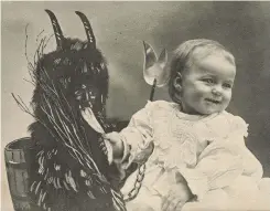 ??  ?? ABOVE Krampus meets his match – this baby isn’t the least bit scared of the evil ghoul!