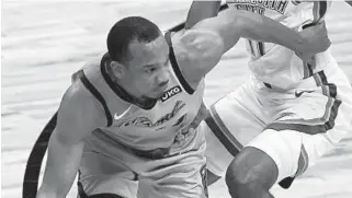  ?? MARTA LAVANDIER/ AP ?? Veteran guard Avery Bradley has quickly grown comfortabl­e wearing the Heat’s colors.