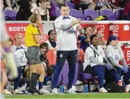  ?? Phelan M. Ebenhack/Associated Press ?? U.S. head coach Vlatko Andonovski, center, talks with an official during the second half of a SheBelieve­s Cup women’s soccer match against Canada on Feb. 16 in Orlando, Fla.