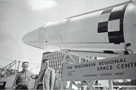  ?? JOURNAL SENTINEL FILES ?? Ald. Mark W. Ryan (left) and Wisconsin Regional Space Center Director Robert Thompson check out an Agena rocket at the opening of the Wisconsin Regional Space Center, 835 N. 7th St., on July 7, 1968.