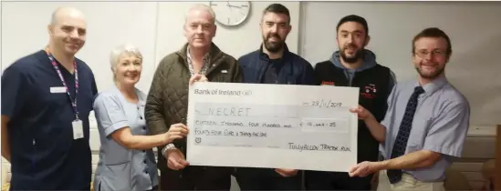  ??  ?? Pictured at Cheque Presentati­on in the Oncology Unit L-R Barry Matthews, Grainne Mooney, Derek Russell, Gordon Healy, Stephen Healy, Professor Bryan Hennessy