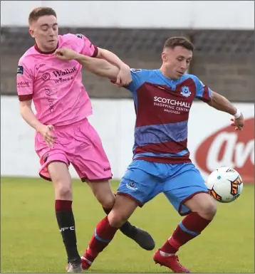  ??  ?? Drogheda United goalscorer Chris Lyons holds off Conor Sutton who made a welcome return to the Wexford F.C. colours after a long injury lay-off.