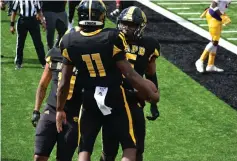  ?? (Pine Bluff Commercial/I.C. Murrell) ?? UAPB quarterbac­k Skyler Perry (11) chest-bumps tight end Jeremy Brown after a 1-yard rushing touchdown against Prairie View A&M on Saturday.