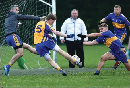  ??  ?? Beaufort’s Ronan Ferris scores his side’s second goal against Michael Cusack’s from Clare in the Munster Club JFC semi-final at Beaufort on Saturday. Photos by Michelle Cooper Galvin