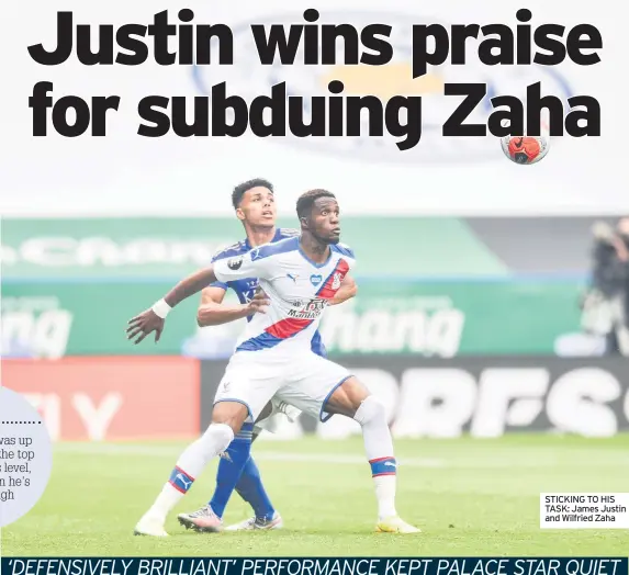  ??  ?? STICKING TO HIS TASK: James Justin and Wilfried Zaha