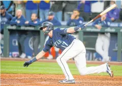  ?? USA TODAY SPORTS ?? Mariners right fielder Mitch Haniger hits a two-RBI single against the Angels during the eighth inning.