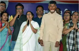  ?? — PTI ?? West Bengal chief minister Mamata Banerjee with TDP chief and Andhra Pradesh chief minister N. Chandrabab­u Naidu stand for the national anthem after announcing the end of her 46- hour- long dharna in Kolkata on Tuesday.