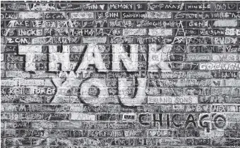  ?? THE ASSOCIATED PRESS ?? Messages in support of the Chicago Cubs’ championsh­ip run and in remembranc­e of friends and family who never saw the Cubs win the World Series are written and drawn in chalk on an outer wall at Wrigley Field.