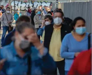  ?? (AP/Manu Fernandez) ?? People line up Wednesday for a rapid antigen test for covid-19 in Madrid, Spain.