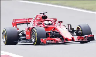  ??  ?? Ferrari driver Sebastian Vettel of Germany steers his car during the qualifying session for the Chinese Formula
One Grand Prix at the Shanghai Internatio­nal Circuit in Shanghai on April 14. (AP)