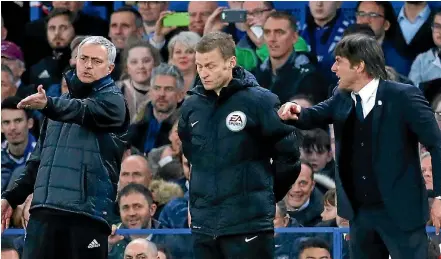  ?? PHOTO: REUTERS ?? Manchester United manager Jose Mourinho, left, and Chelsea manager Antonio Conte dispute a decision with the fourth official during their teams FA Cup quarterfin­al st Stamford Bridge yesterday.