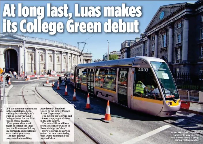  ??  ?? HiSTORiC: The Luas tram snakes its way past the entrance to Trinity College during yesterday’s test