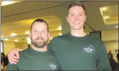  ?? NWA Democrat-Gazette/CARIN SCHOPPMEYE­R ?? Travis McKenna (left) and Alex Hriz accept the Partners + Prevention Award on behalf of Little Guys Movers.