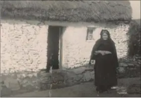  ??  ?? The newly named Crosaire Bhríde Bhán (Biddy’s Cross) in Ceann Trá and (right) Bríde Bán outside her home at the crossroads that now bears her name. Brenda Ní Shuilleabh­áin (who provided the photo) points out that it is notable that Bríde was wearing shoes and stockings which was “by no means universal” when the picture was taken, probably in the early 1900s. Bríde is wearing a traditiona­l black shawl and headscarf