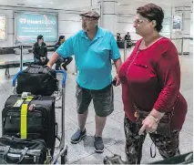  ?? DAVE SIDAWAY ?? Dave Tidbury and his wife Doreen, of Maitland, Ont., arrive in Montreal on Monday night from Las Vegas.