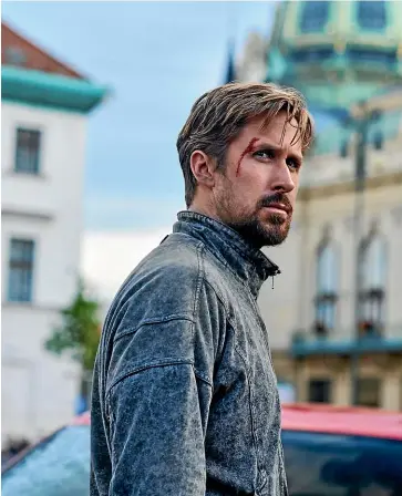  ?? STANISLAV HONZI ?? Ryan Gosling stars as The Gray Man’s Court Gentry.