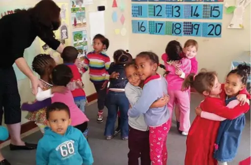  ??  ?? GETTING ALONG: Each child attends a weekly half-hour lesson taught by Ms Manners. Workshops also address the issue of bullying among the children.