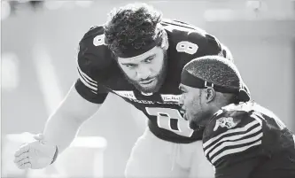  ?? PETER POWER THE CANADIAN PRESS ?? Hamilton Tiger-Cats quarterbac­k Jeremiah Masoli weathered season-ending injuries to several capable receivers, including Brandon Banks, right, to earn East Division all-star recognitio­n.