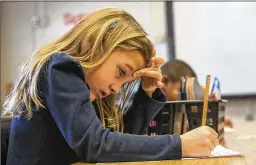  ?? ALYSSA POINTER / ALYSSA.POINTER@AJC.COM ?? Amelia, a Benteen Elementary kindergart­ner, sounds out a word during a phonics lesson Thursday at the Atlanta school. As students age past third grade, a teaching adage goes, they shift from learning to read to reading to learn. Any delay in acquiring the skill can doom a student’s prospects.