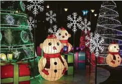  ??  ?? The annual Downtown Lanterns and Lights event, Nov. 24 through Jan. 1, features a magical display of Christmas trees, festive photo props and other artisan-made pieces.