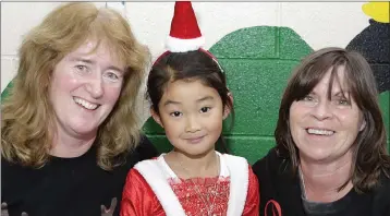  ??  ?? Judy Brierton, Zara Zhang and Rosie Armstrong at the St Cronan’s Christmas Fair