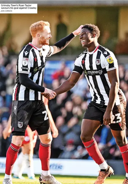  ?? JON CORKEN ?? Grimsby Town’s Ryan Taylor savours his goal against Crawley