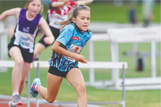  ??  ?? HIGH HOPES: Chelsea Capps competes in the Under 10 girls hurdles. Picture: BRENDAN RADKE