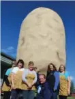  ?? JENNIFER BAIN/TORONTO STAR ?? Staff of the Canadian Potato Museum in O’Leary, P.E.I. with the Big Potato.