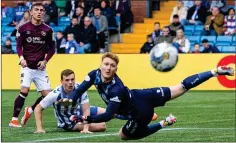  ?? ?? CLOSE BUT NO CIGAR: Hearts’ Kenneth Vargas nearly finds the net as Kilmarnock goalkeeper Will Dennis looks on anxiously