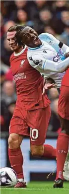  ?? AFP PIC ?? Crystal Palace’s Eberechi Eze (right) and Liverpool’s Ibrahima Konate vie for the ball during Sunday’s Premier League match at Anfield.