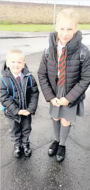 ??  ?? New start P1 pupil Jayden Frew with big sister Sharelle, who is a P7 pupil, at St Patrick’s Primary School